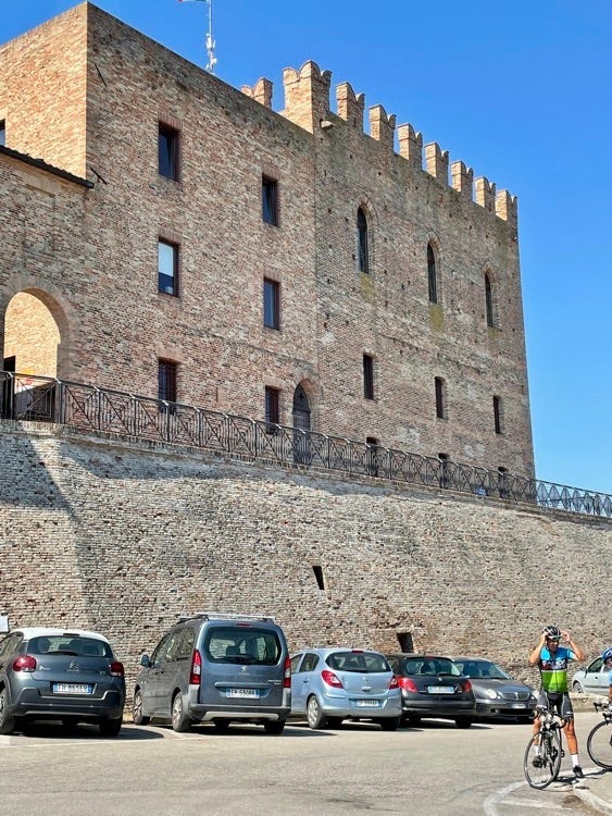 View of the Rocca of Montefiore from below and entrance to the castle. Below, the Rocca Malatestiana of Mondaino and the entrance to the Malatesta Pits.