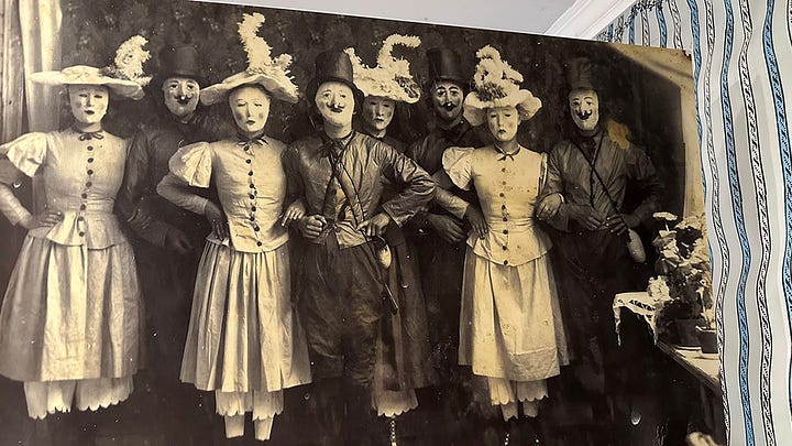 Details from Finland: 1. Moomin Shop window display of characters, 2. Nautical signal flags in Turku, 3. Carpentry details of a wooden house in Old Rauma, 4. Old photo of people dressed in masquerade from Naantali Museum