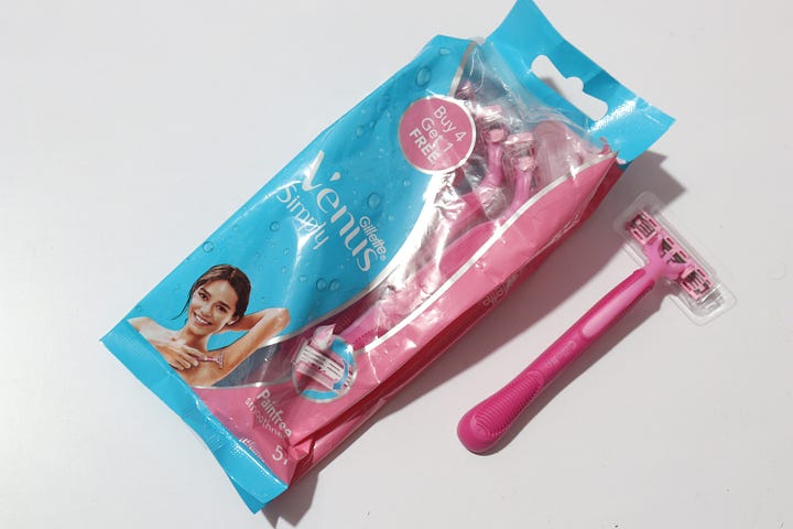 A pack of Venus razors for women and a Mars chocolate bar
