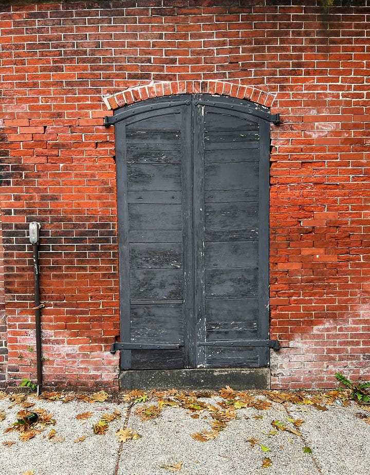 Two pictures of unmarked doors via Unsplash. Neither of these is the one we're talking about.