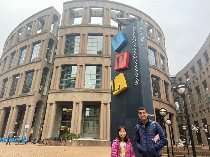 Left: man and girl in front of Vancouver Public Library. Right: In the walkway inside the library, with tall glass and steel ceiling.