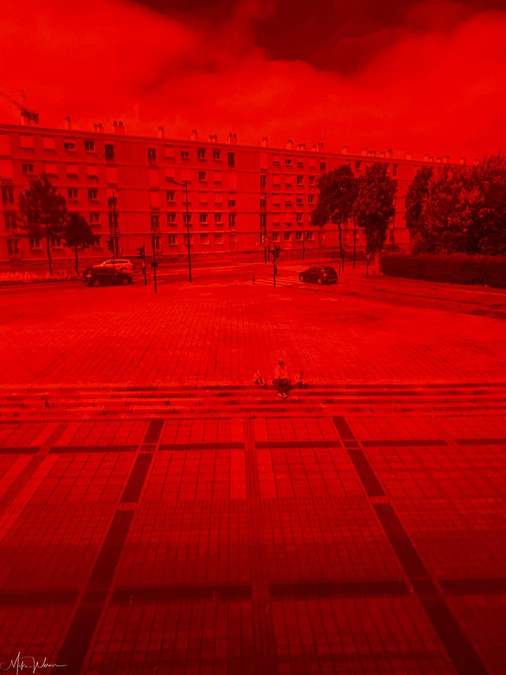 Glass windows and view through one (red) stained glass