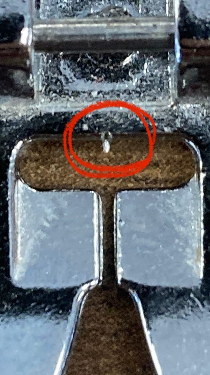 Close-up of a presser foot burr