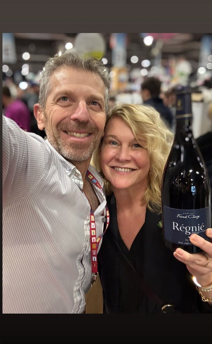 Karen Bussen holds a bottle of Beaujolais while posing for a selfie with Franck Chavy. Details from a wine expo in Paris, and a wine stopper made from an old doorknob