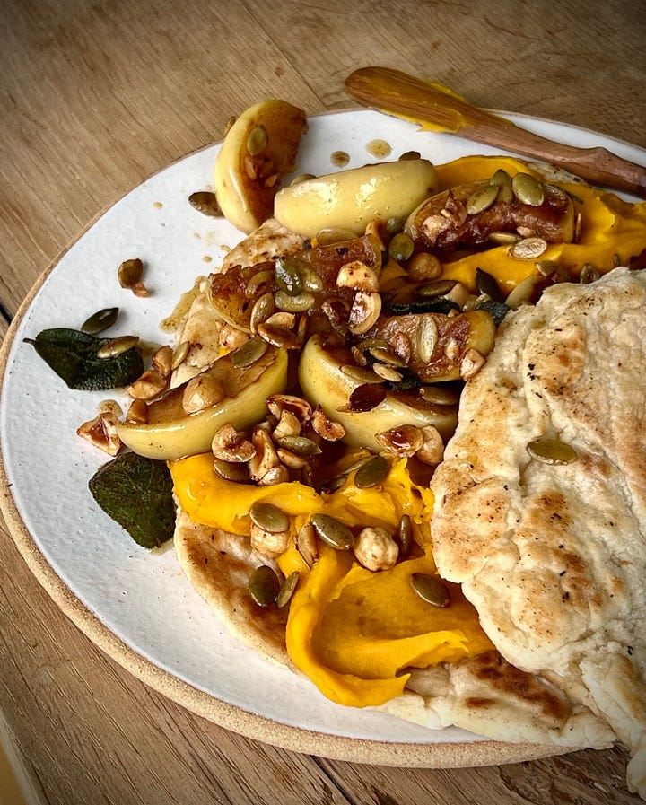 Pumpkin hummus flatbreads with fried apple and sage in various states of eating