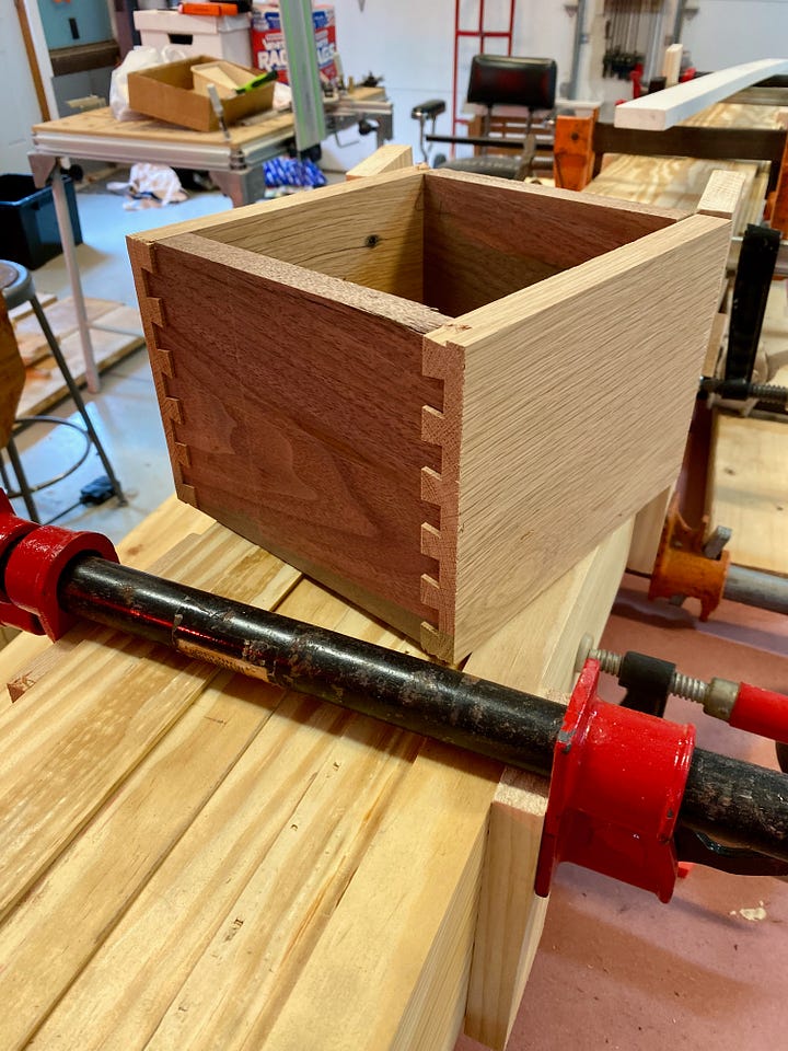 Cutting the extended dovetails flush.