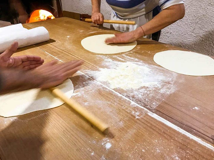 rolling out dough for pane carasau