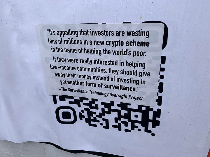 Left: A row of posters with a chrome sphere, reading "Orbs in SF. July 20–27". "Book an appointment to sign up for your World ID". Right: A sticker covering a QR code, which reads in black text: "It's appalling that investors are wasting tens of millions in a new crypto scheme in the name of helping the worlds' poor. If they were really interested in helping low-income communities, they should give away their money instead of investing in yet another form of surveillance." - The Surveillance Technology Oversight Project