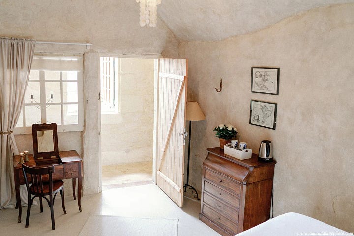 Scenes from troglodyte cave home near Amboise. Breakfast table, bedroom with bathtub and details.