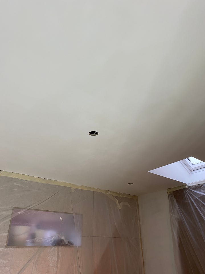 newly painted ceiling in white and the wall plaster boarded