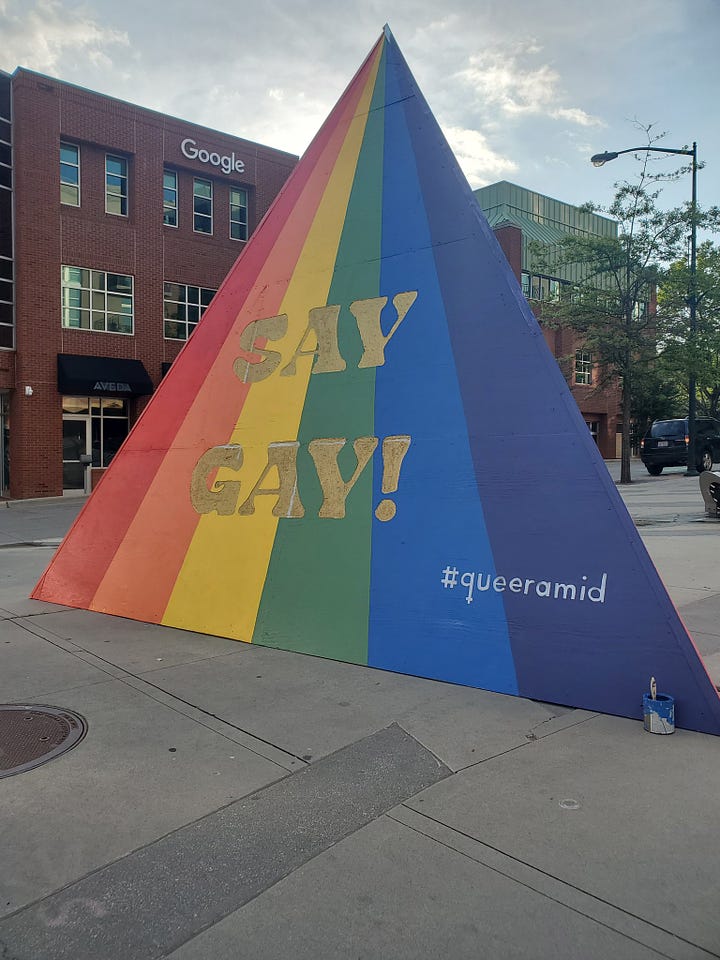 the three sides of the "queeramid" erected by the Chapel Hill government: "The First Pride Was A Riot", "Black Trans Lives Matter", and "Say Gay!"