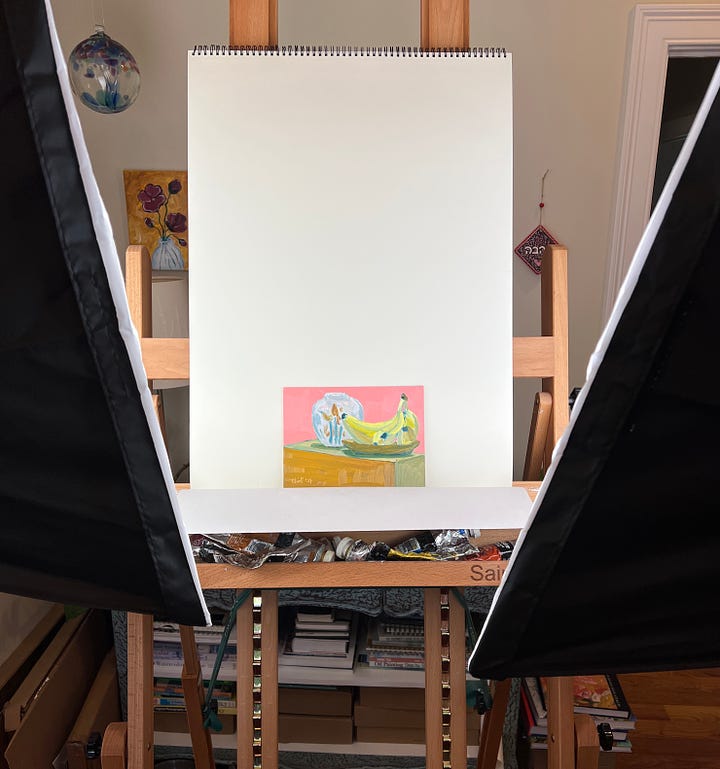 Two images showing the photography set-up inside an art studio for photographing paintings.