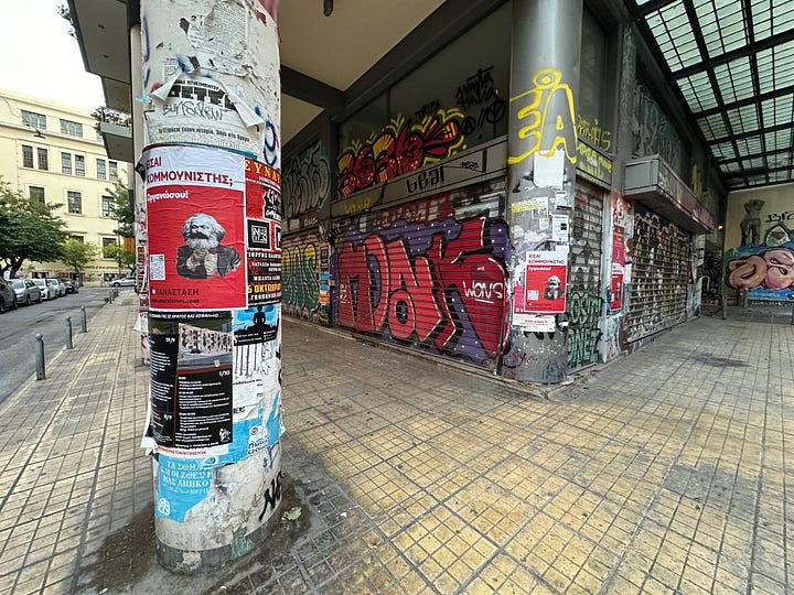 Photos of downtown Athens, statues, buildings with graffiti 