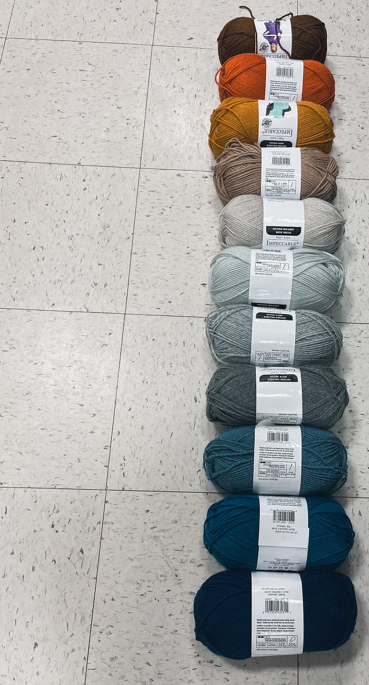 The first image shows 11 balls of yarn as a gradient from chocolate brown through orange, yellow, taupe, and grey, to blues, ending in navy blue, along a store floor. The second photo is the author in black toque, holding a finished crocheted blanket that used the yarn to record the daily high temperatures in 2023. 