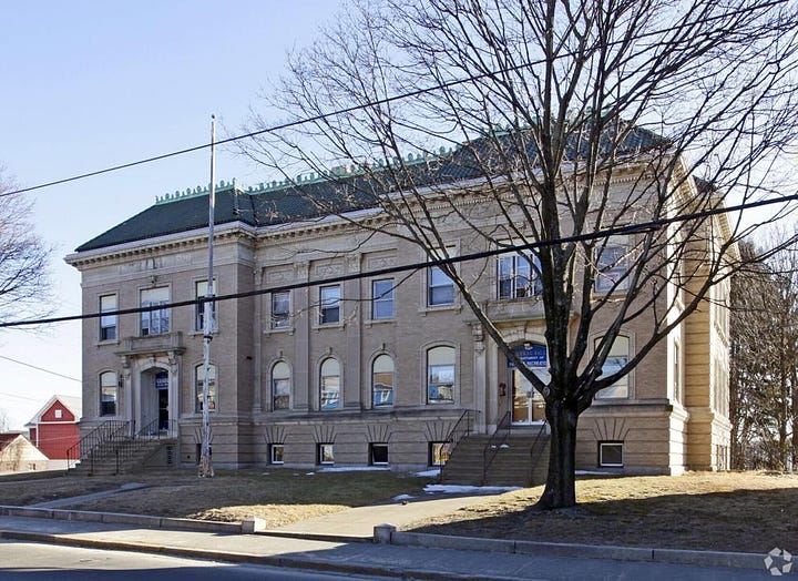 Central Falls police station at left; historic mill buildings at right