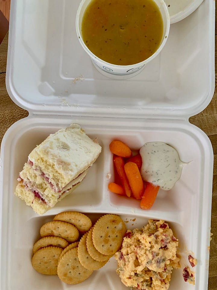 various meals, including pimento cheese with soup, baby carrots, ranch strawberry shortcake; sandwiches, fruit, and a pot pie in a bowl