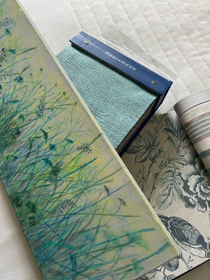 fabric swatches and a painting of wildflowers