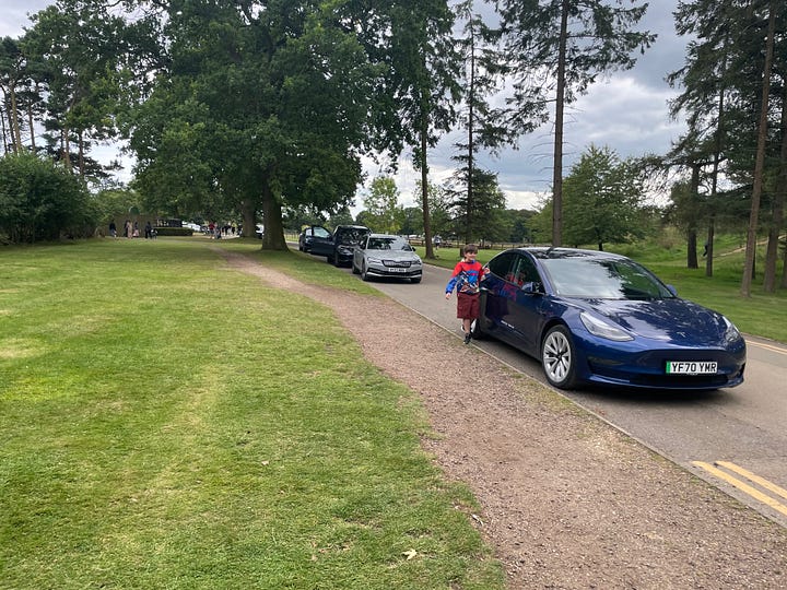 Cars driving and parked around Whipsnade Zoo