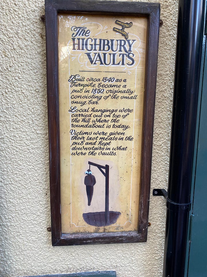 Jonathon Campbell Mills and a poster on the wall of The Highbury Vaults Pub