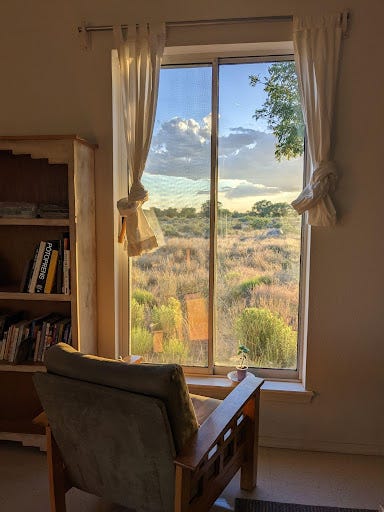 Two images. The left is of a field of desert grasses at sunset. The right is taken from inside a house. It shows an armchair in front of a tall window. Outside the window is a beautiful field of grass and shrubs.