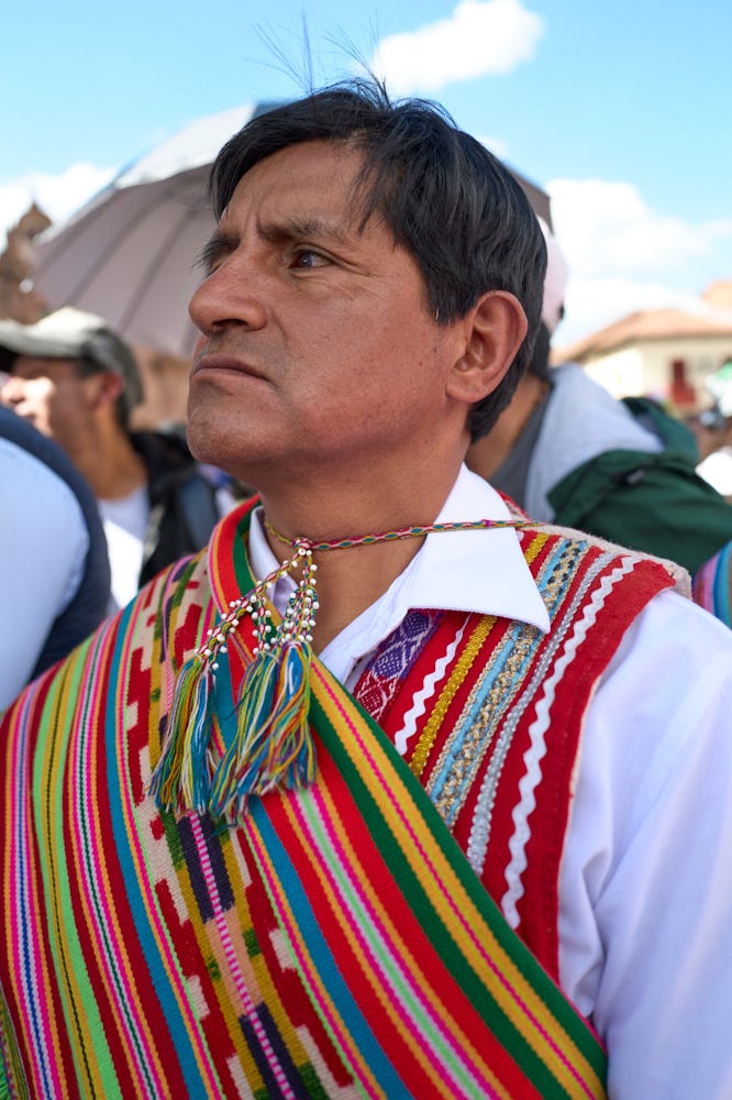 Four portraits taken during the Corpus Christi procession. The portraits show the diverse costumes of the procession attendees including two brightly colored rainbow outfits. 