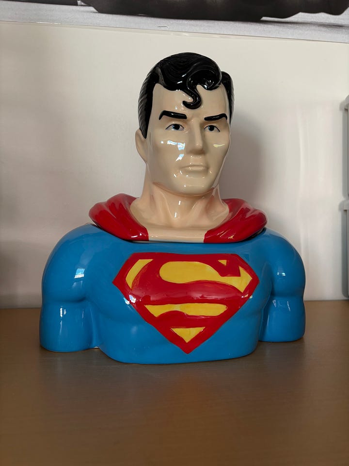 A ceramic candy-jar bust of Superman, filled with Jolly Rancher candies.