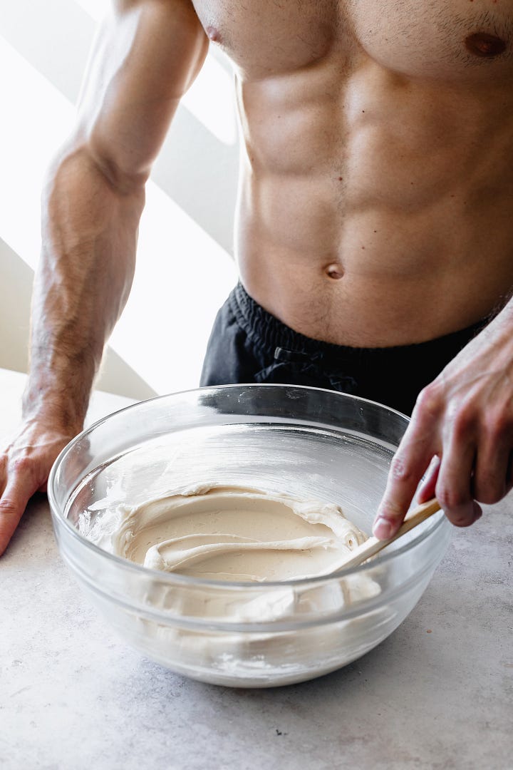 Shirtless man in black pants making vegan American buttercream step by step
