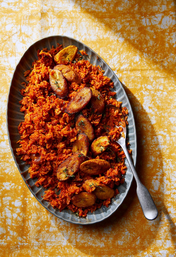 Photo one: an overhead shot of a bowl of bright orange-red jollof rice, with fried sweet plantains on top. Photo two: a bowl of confited cherry tomatoes, topped with slices of fried halloumi cheese.