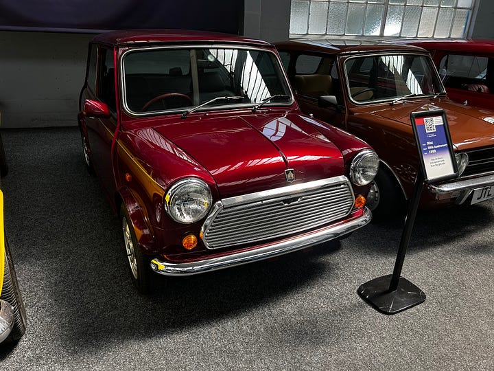 This is one of the last old style Minis made. This red mini was one of a pair purchased by a gentleman as an investment for his young sons. When try grew up they were very tall and not interested in the small cars. This is one of them and has just 18 miles on the clock! It is in showroom condition. One image is of the inside looking at the steering wheel and dashboard. Image: Roland's Travels 2023