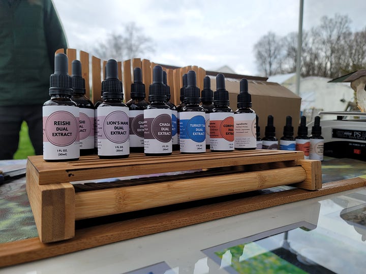 Pictures of our table and products at a farmers market 