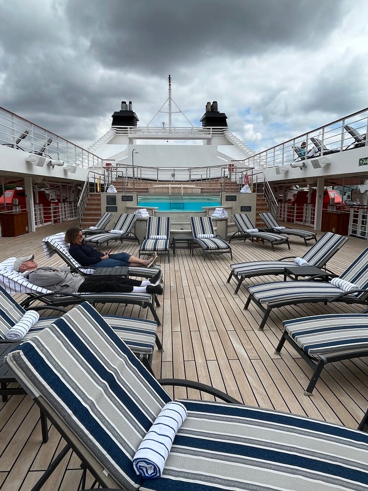 Four images of the Windstar Legend cruise yacht including one on the ocean, one on the deck and swimming pool and two with London's Tower Bridge in the background