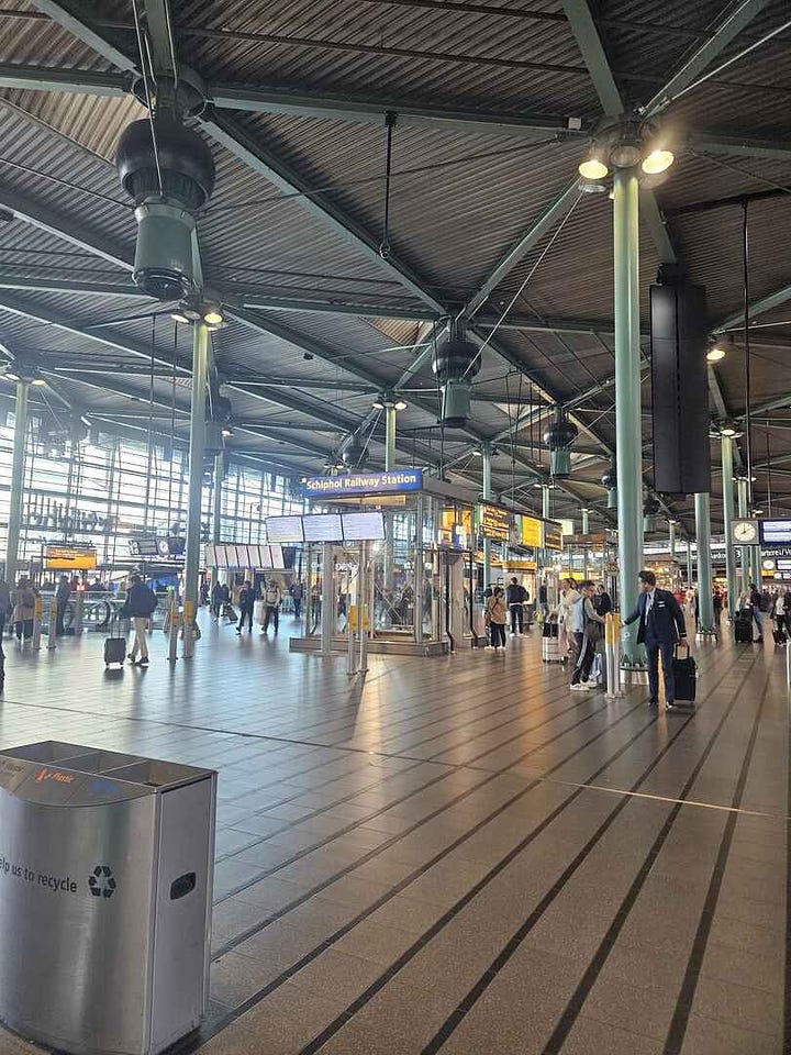Image of the train station inside the airport in Amsterdam and a close up of the ticket kiosk.