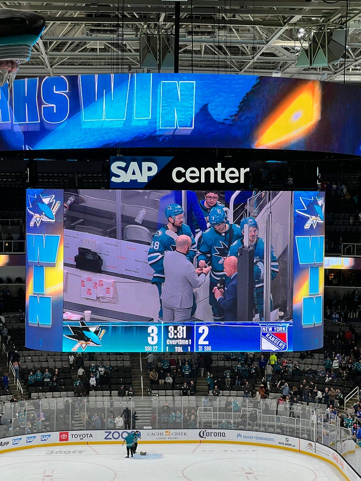 image of scoreboard, image of two smiling women, image of scoreboard, image of hockey rink