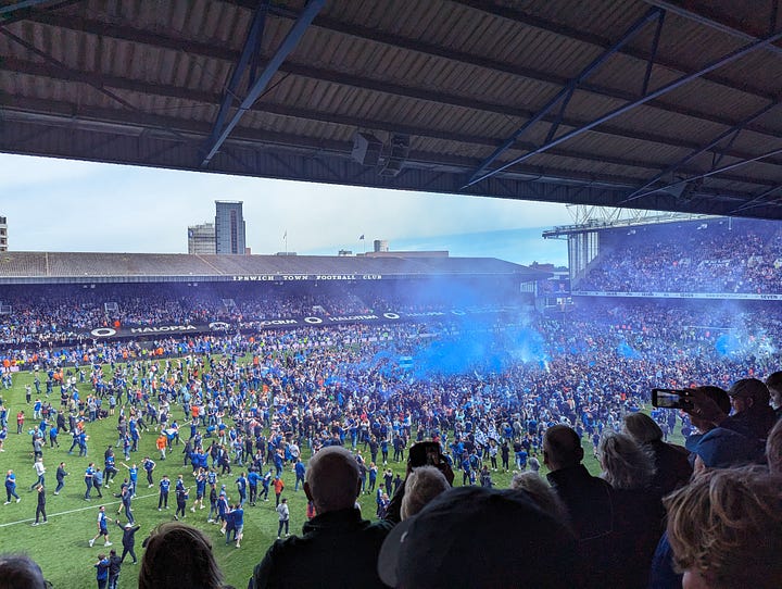 Five images of the pitch invasion after Ipswich win promotion