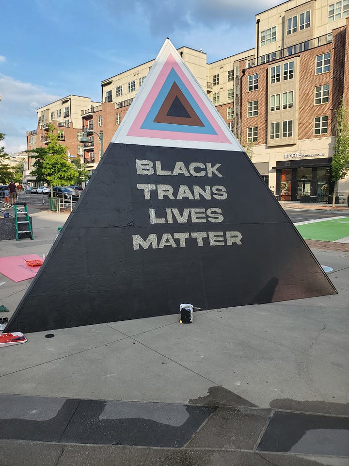 the three sides of the "queeramid" erected by the Chapel Hill government: "The First Pride Was A Riot", "Black Trans Lives Matter", and "Say Gay!"