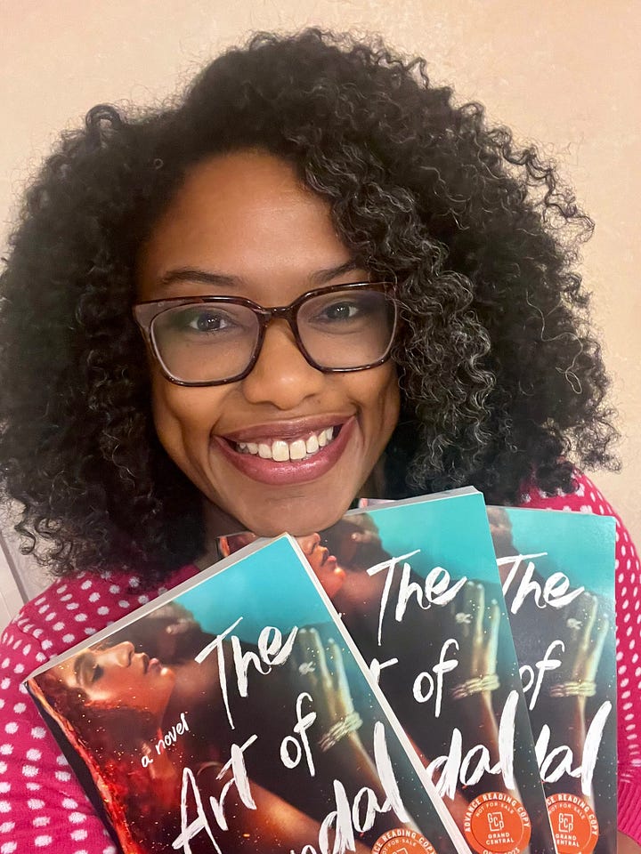 The photo on the right is a picture of THE ART OF SCANDAL galleys. The photo on the left is a picture of Regina Black holding three copies of the THE ART OF SCANDAL