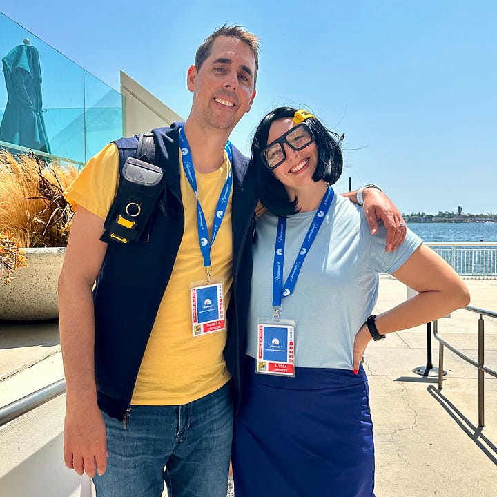 Alyssa dressed as Tina Belcher from Bob's Burgers, posing with her husband Tom as Jimmy Jr. and another fan dressed as Louise