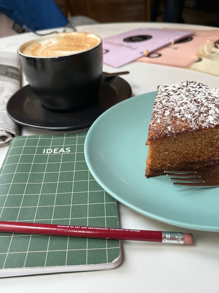 Four examples of lemon tarts and cakes in Menton, with cup of coffee. Served with ice cream, meringue, chocolate sauce and overseen by my new travelling pal, Mentonella (top right).