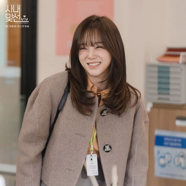 four images of actress Kim Sejeong in her role as Shin Hari in the Kdrama Business Proposal.