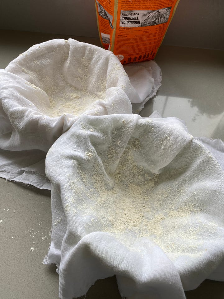 Bowls lined with muslin and dusted with flour.