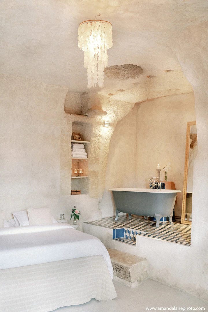 Scenes from troglodyte cave home near Amboise. Breakfast table, bedroom with bathtub and details.