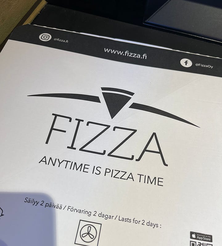 Photo 1 shows the Fizza Room, where you can get a fresh-basked pizza in 3 minutes; Photo 2 shows the box, which claims, rightly, that "Anytime is Pizza Time"