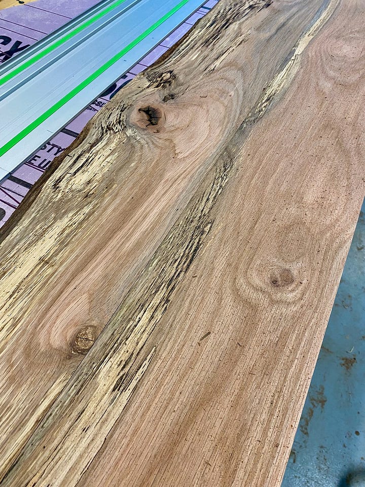 Reclaimed wood being sawed.