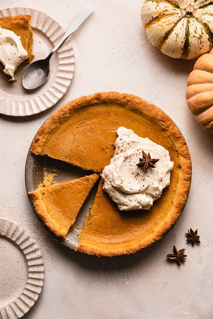 Keto pumpkin pie with whipped cream and a closeup of keto spice cake slice. 