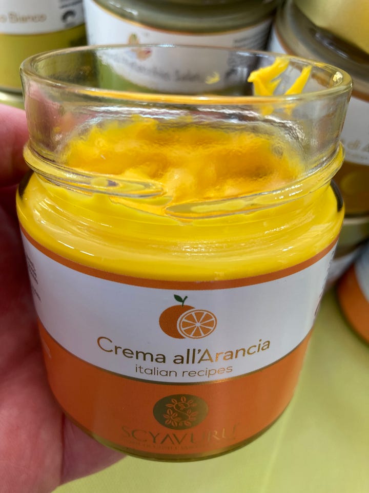 Two images of citrus and citrus-based products from Terra Madre, including bergamot (right) and a jar of orange curd from Spain..