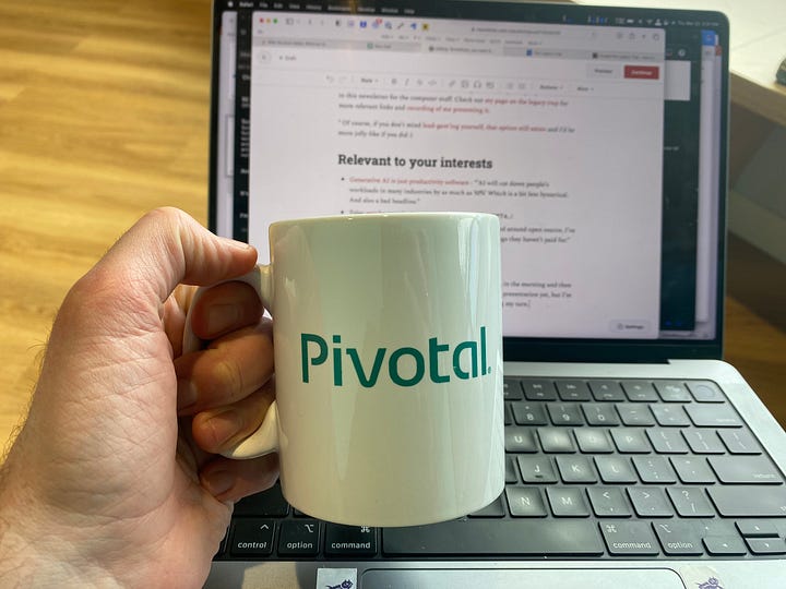 A Pivotal coffee mug, both sides.