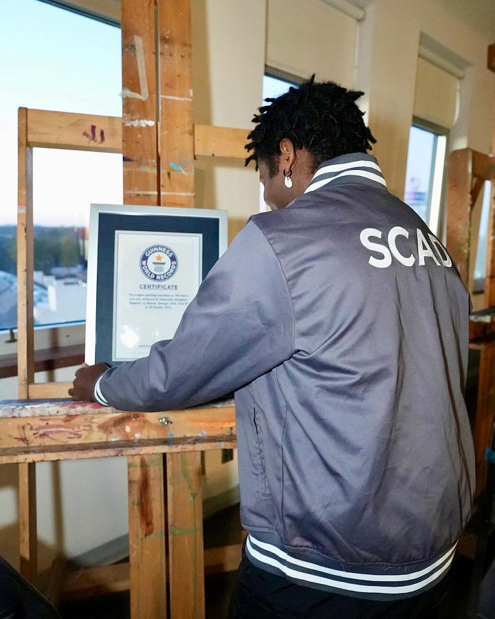 Chancellor sharing a picture of his GWR certificate for the longest painting marathon record
