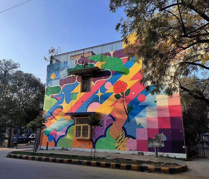 4 images of colourful murals of walls in Delhi