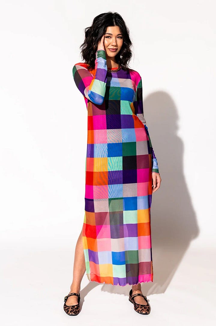 A long sleeve long dress with blocks of color and a pair of red flat shoes