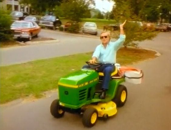 Dolly Parton writing a song with big hair, George Jones riding a lawnmower